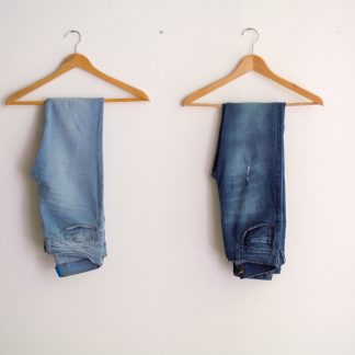 two hanged blue stonewash and blue jeans