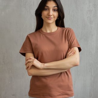 smiling young woman in casual outfit in studio