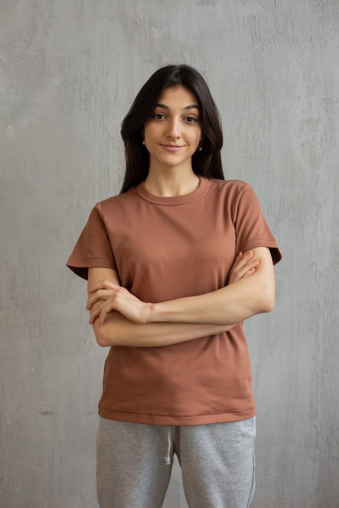 smiling young woman in casual outfit in studio